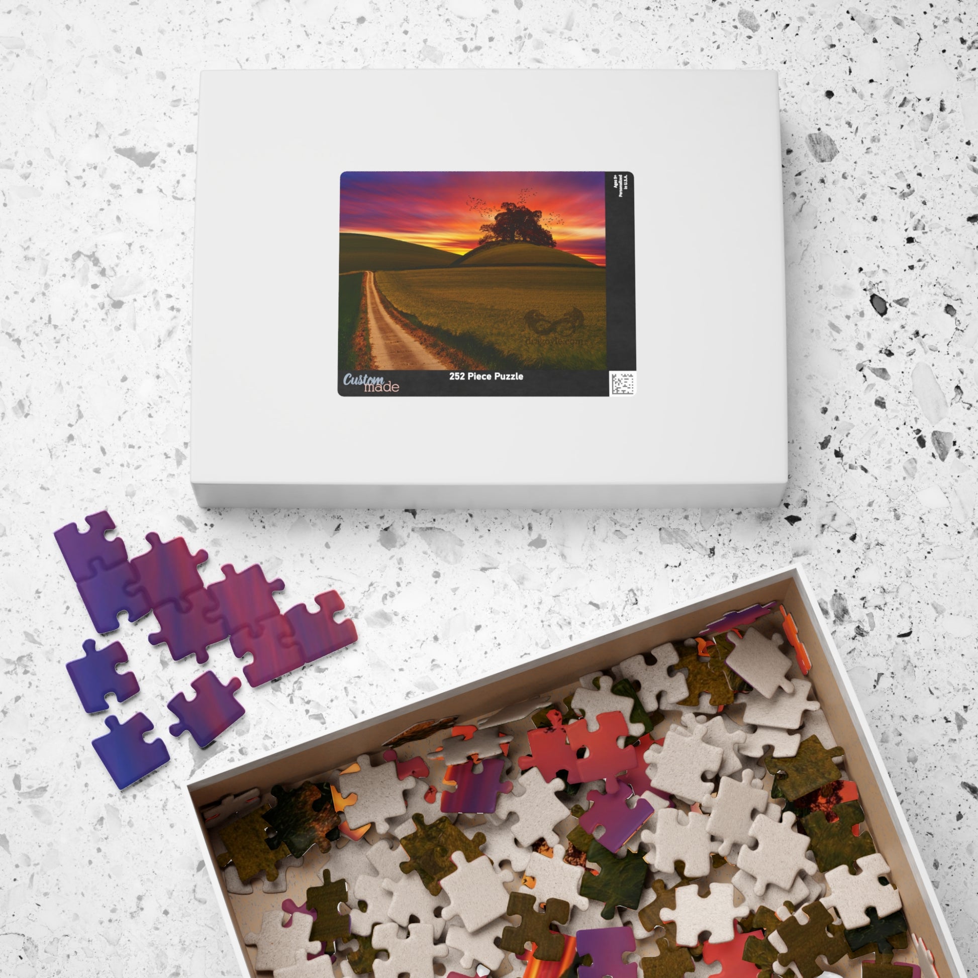 Experience the serene beauty of a country road at sunset with our Country Road Sunset Puzzle. This high-quality puzzle comes with 110 to 1014 pieces, making it perfect for all levels of puzzlers. Each piece fits seamlessly to create a stunning landscape that will provide hours of relaxation and enjoyment.