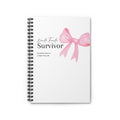 Notebook with a pink bow design and text on a white background