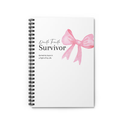 Notebook with a pink bow design and text on a white background