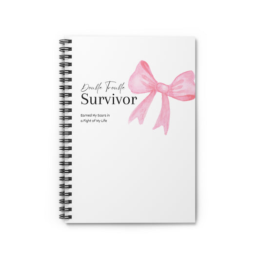 Notebook with a pink bow design and text on a white background