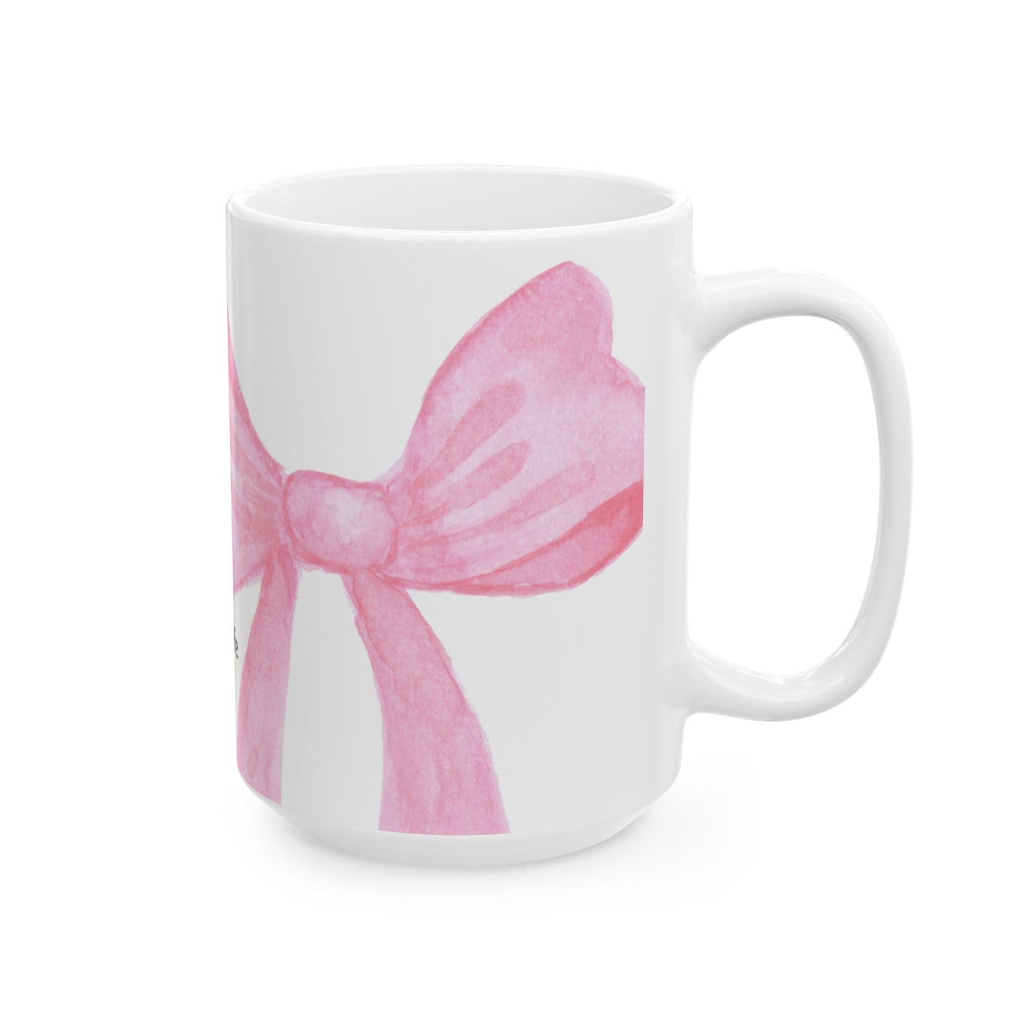 White mug with a pink bow design on a white background