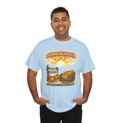 A man wearing a light blue graphic t-shirt with a 'Pumpkin Patch' autumn harvest design, set against a plain white background.
