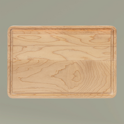 Wooden cutting board on a gray background