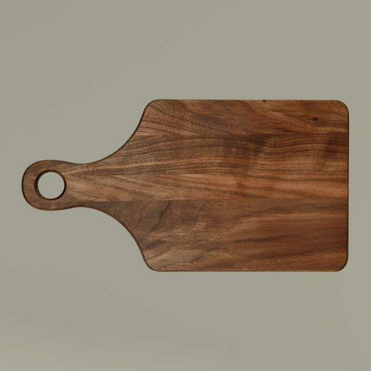 Wooden cutting board with a handle on a beige background