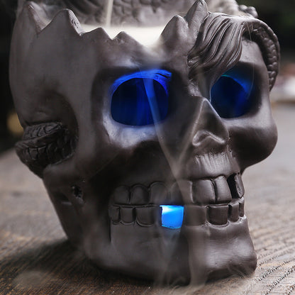 Elevate your space with the Aromatherapy Skull Dragon Backflow Incense Burner. This striking piece combines dramatic skull and dragon motifs to create a captivating focal point.