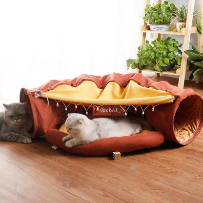 Give your cat a cozy and playful retreat with this Foldable Cat Tunnel &amp; Bed. Designed for both entertainment and comfort, it easily folds for convenient storage or travel. Perfect for cats who love to hide, pounce, or relax, this versatile tunnel doubles as a soft bed, creating a safe space your feline friend will adore.