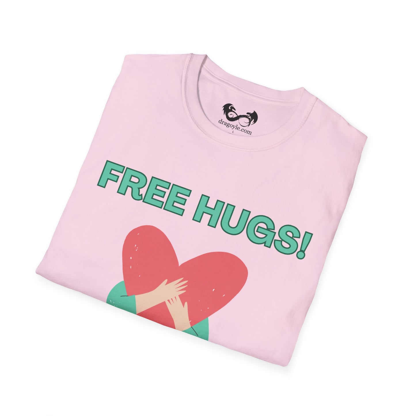 Folded pink t-shirt with 'FREE HUGS!' text and heart graphic on a white background