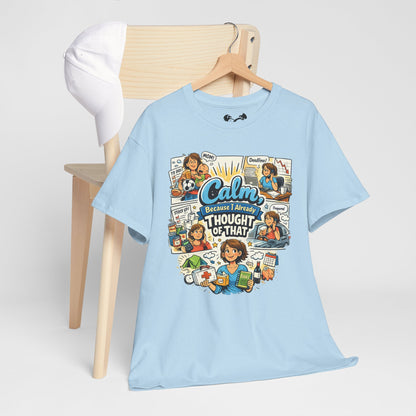 Light blue t-shirt with colorful graphic design on a wooden chair against a white background