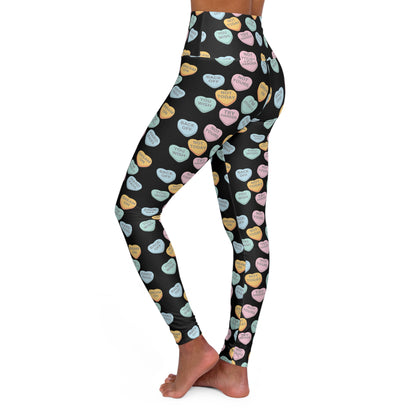 Leggings with colorful heart pattern on a black background