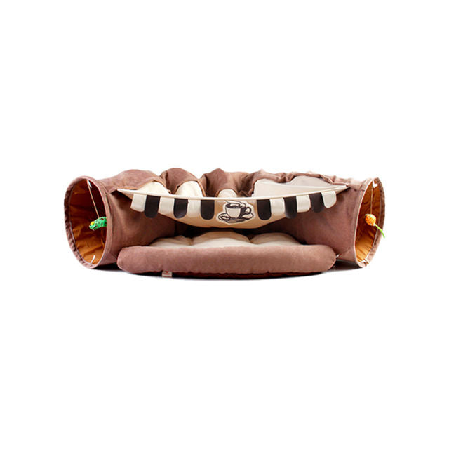 Give your cat a cozy and playful retreat with this Foldable Cat Tunnel &amp; Bed. Designed for both entertainment and comfort, it easily folds for convenient storage or travel. Perfect for cats who love to hide, pounce, or relax, this versatile tunnel doubles as a soft bed, creating a safe space your feline friend will adore.