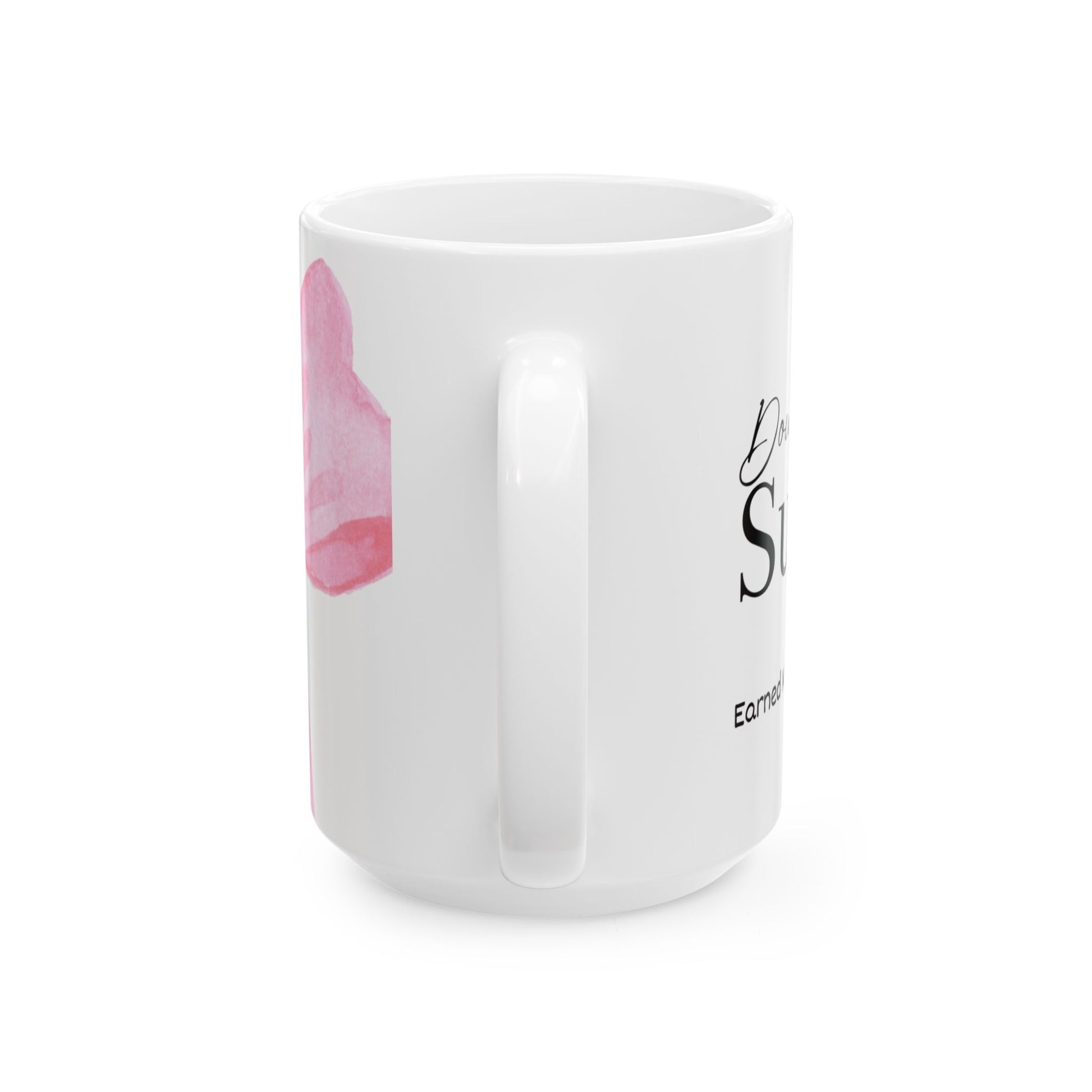 White mug with pink design and text on a white background