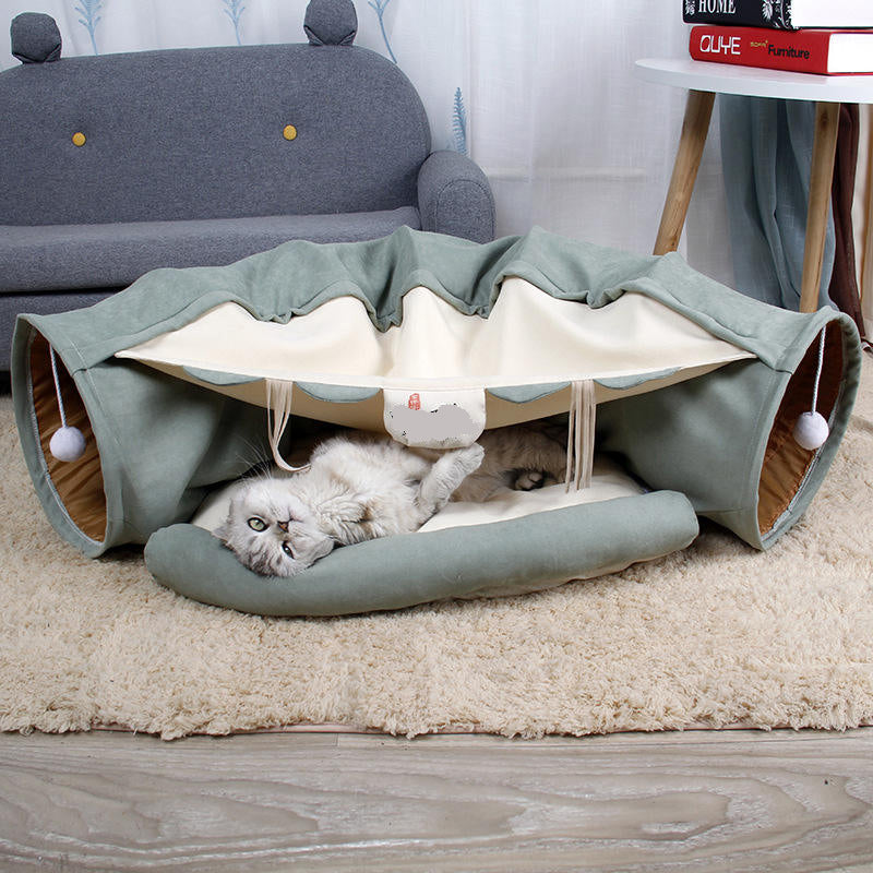Give your cat a cozy and playful retreat with this Foldable Cat Tunnel &amp; Bed. Designed for both entertainment and comfort, it easily folds for convenient storage or travel. Perfect for cats who love to hide, pounce, or relax, this versatile tunnel doubles as a soft bed, creating a safe space your feline friend will adore.