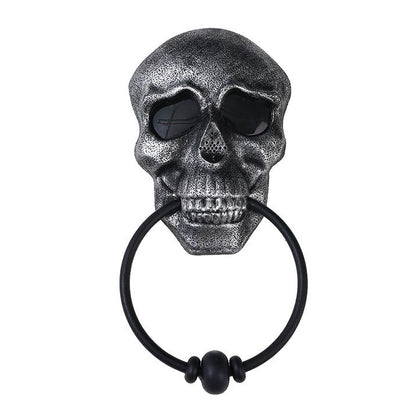 Make a bold statement this Halloween with the Halloween Skull Door Knocker. Crafted to catch attention, this striking decoration adds a spooky touch to your front door while serving as a functional knocker. Its detailed skull design creates an eerie atmosphere that sets the perfect mood for your Halloween festivities.