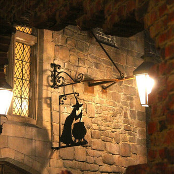 Bring a little magic to your home with this Witch & Cauldron Metal Wall Art. This artistic piece depicts a witch stirring her cauldron, creating something enchanting and sure to bring a unique atmosphere to any area it hangs.
