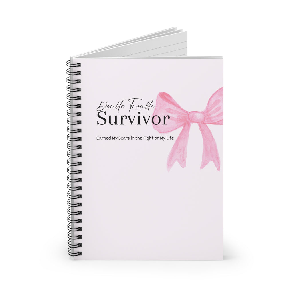 Notebook with a pink bow design and text on a white background
