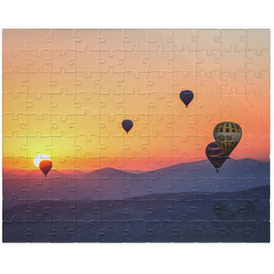 Embark on a journey through the sky with our Hot Air Balloons at Sunset Puzzle. With 110 to 1014 pieces, this puzzle will challenge your mind and soothe your soul. Take in the stunning artistry of the colorful hot air balloons against the dramatic sunset backdrop.