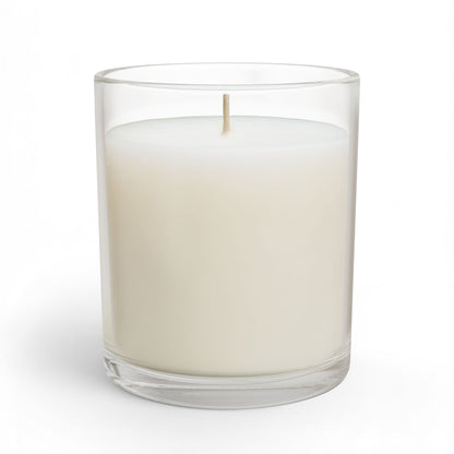White candle in a clear glass container on a white background