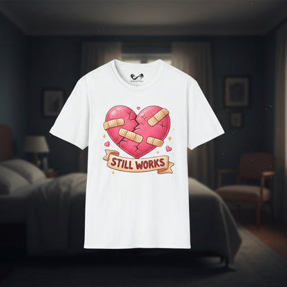 White t-shirt with a heart graphic and 'Still Works' text on a white background