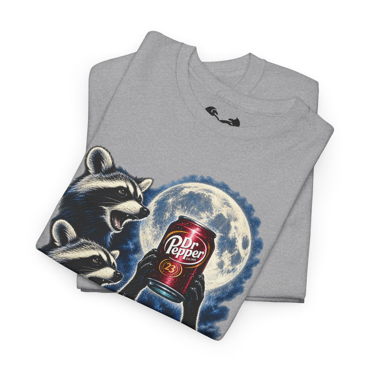 A folded heather gray t-shirt featuring a graphic print of two raccoons holding a red Dr. Pepper can in front of a full moon.