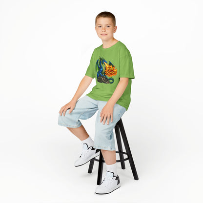 Child wearing a green t-shirt with a graphic design, sitting on a stool against a white background