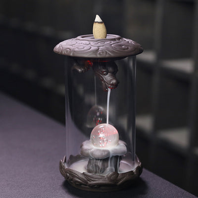 Upgrade your incense game with our Purple Sand Dragon Backflow Incense Burner. This beautiful burner features a unique design that releases a downward flow of smoke, creating a mesmerizing and relaxing ambiance. Perfect for meditation, yoga, or simply unwinding after a long day.