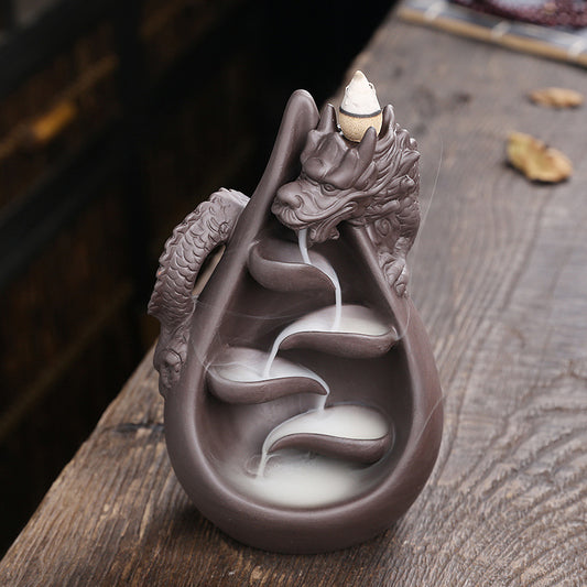 Upgrade your home decor with our Creative Dragon Backflow Incense Burner! Featuring a unique design, it not only adds a touch of elegance to any room but also creates a relaxing and soothing atmosphere with its backflow incense effect. Perfect for those looking for a calming and stylish addition to their space.