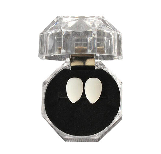 Transform your smile with Vampire Fangs Tooth Caps, perfect for adding a thrilling, spooky touch to your look. These easy-to-wear caps create a striking vampire aesthetic, ideal for costumes, parties, and Halloween events.