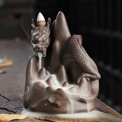 This handmade Purple Sand Dragon Backflow Incense Burner is the perfect addition to any room. With its intricate design and durable construction, you'll be enchanted by the mystical smoke that cascades down the figure.