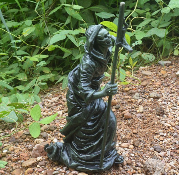Spook up your garden with this unique hand-painted Grim Reaper sculpture! With its bold and daring design, it will be sure to add an adventurous touch to your Halloween décor.