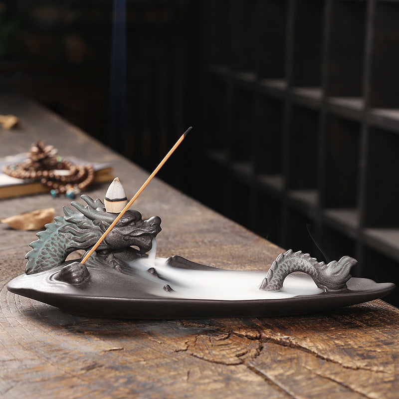 Create a soothing and relaxing ambiance with our Ceramic Aromatherapy Dragon Backflow Burner. This beautifully crafted burner not only adds a touch of elegance, but also helps to purify the air and promote a sense of calm with its backflow feature. Perfect for any home or office space.