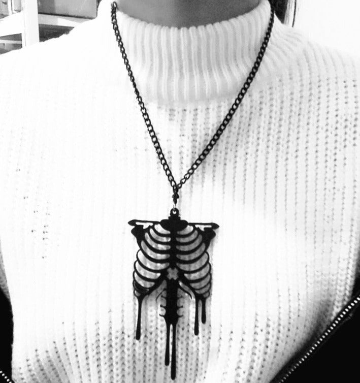 Stand out from the crowd this Halloween with this trendy black skeleton necklace! Its unique design and sleek look will make you the talk of the party. Dare to be bold and express your own style with this necklace!