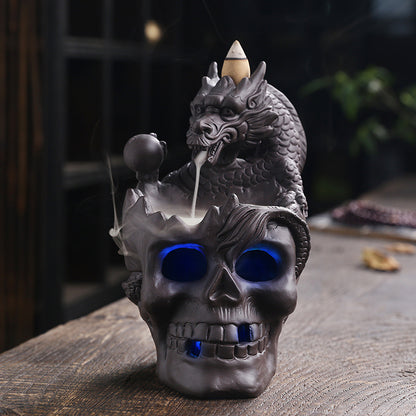 Elevate your space with the Aromatherapy Skull Dragon Backflow Incense Burner. This striking piece combines dramatic skull and dragon motifs to create a captivating focal point.