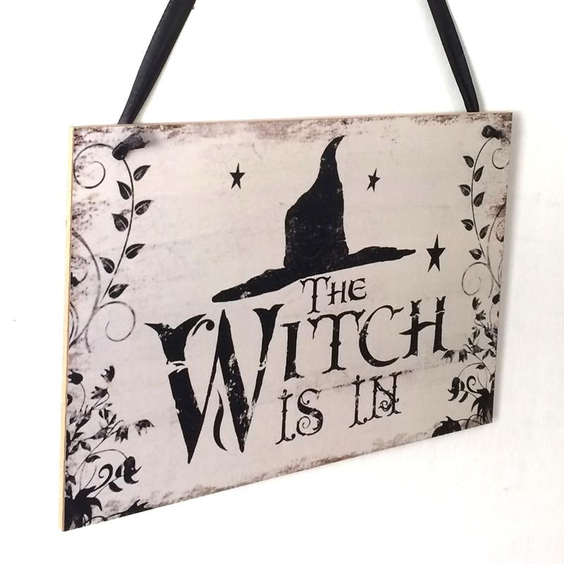 Fly away to the dark side of Halloween décor with this enchanting "The Witch Is In" rustic wooden plaque! This quirky decoration is sure to spark conversations and cast a spell over trick-or-treaters. Come, come! The Witch Is In!  On the back side it says "Out of Candy".