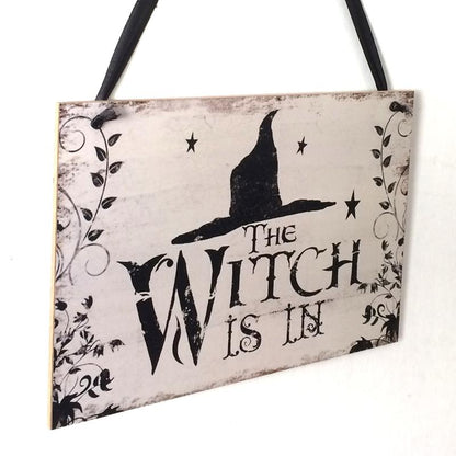 Fly away to the dark side of Halloween décor with this enchanting "The Witch Is In" rustic wooden plaque! This quirky decoration is sure to spark conversations and cast a spell over trick-or-treaters. Come, come! The Witch Is In!  On the back side it says "Out of Candy".