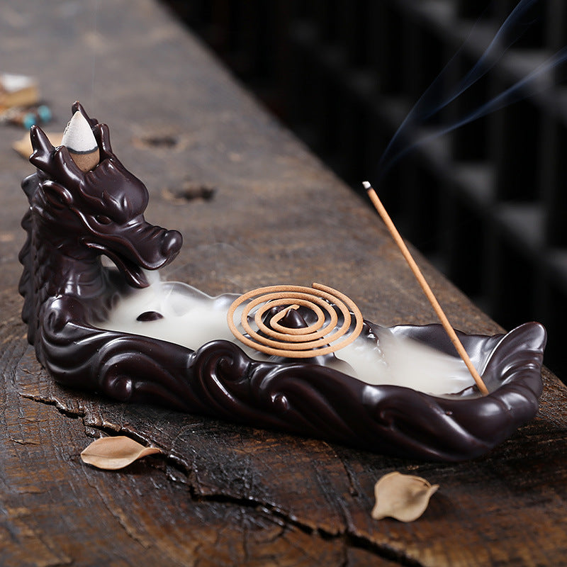 Experience the captivating aroma of burning incense with this stunning Ceramic Backflow Aromatherapy Dragon Incense Burner. Crafted from high-quality ceramic and featuring a majestic dragon design, this incense burner is the perfect way to enhance the atmosphere in any room. 