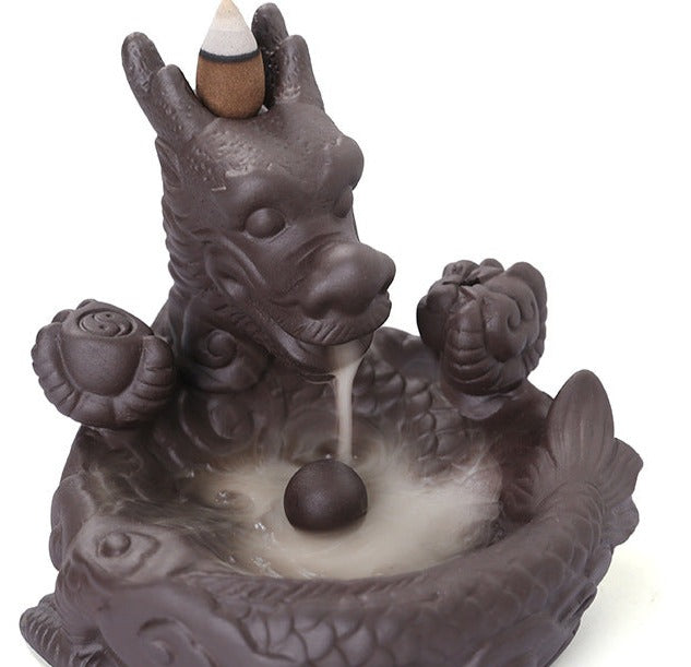 This beautiful Small Dragon Back Flow Incense Burner is a perfect addition to any home. Crafted with intricate details and made from durable material, this incense burner will create an enchanting atmosphere in any room. 