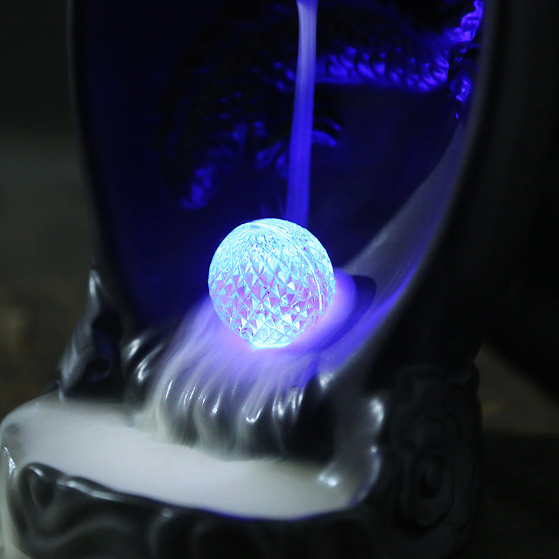 This Creative LED Lamp Backflow Dragon Incense Burner is a unique and eye-catching decoration for any space. Featuring a mesmerizing backflow smoke effect and LED lighting, this burner adds a touch of relaxation and ambiance to any room. 