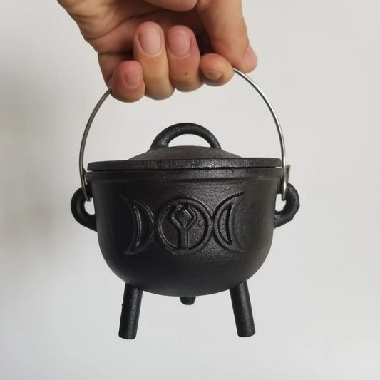 Embrace the mystical energy of the Moon with our Moon Phase Cast Iron Cauldron. Crafted from premium cast iron, this cauldron is not only durable but also adds an artistic touch to any space. 