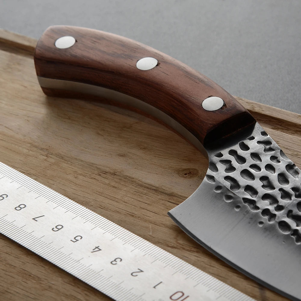 This handcrafted cleaver combines traditional blacksmithing with modern metallurgy. The fortified steel blade, measuring 5.5 inches, delivers exceptional edge retention and durability for precise butchering tasks.