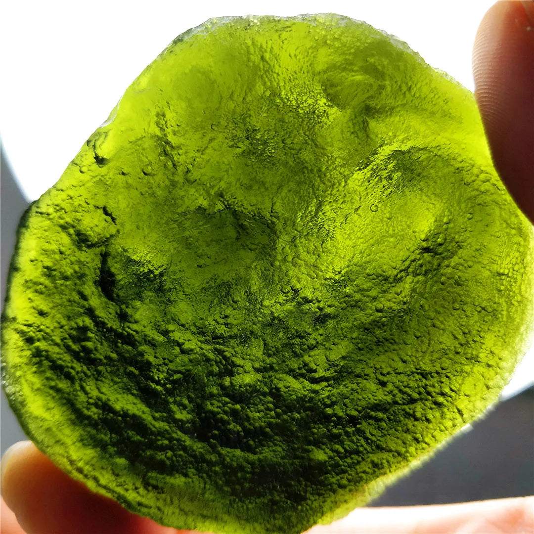 Discover the natural healing powers of the Rare Green Moldavite Crystal. Sourced from the Czech Republic, this crystal is known to relieve stress and anxiety while promoting emotional balance and spiritual growth. Add this unique crystal to your collection for its powerful benefits.