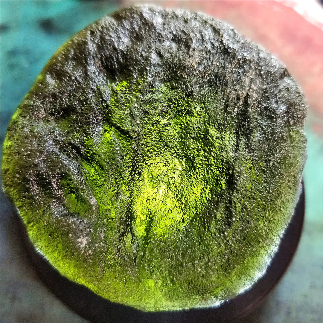 Discover the natural healing powers of the Rare Green Moldavite Crystal. Sourced from the Czech Republic, this crystal is known to relieve stress and anxiety while promoting emotional balance and spiritual growth. Add this unique crystal to your collection for its powerful benefits.