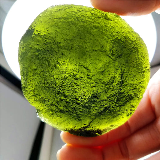 Discover the natural healing powers of the Rare Green Moldavite Crystal. Sourced from the Czech Republic, this crystal is known to relieve stress and anxiety while promoting emotional balance and spiritual growth. Add this unique crystal to your collection for its powerful benefits.