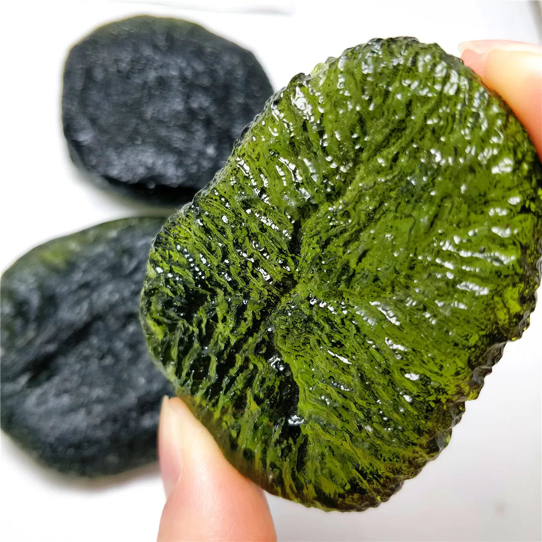 Discover the natural healing powers of the Rare Green Moldavite Crystal. Sourced from the Czech Republic, this crystal is known to relieve stress and anxiety while promoting emotional balance and spiritual growth. Add this unique crystal to your collection for its powerful benefits.