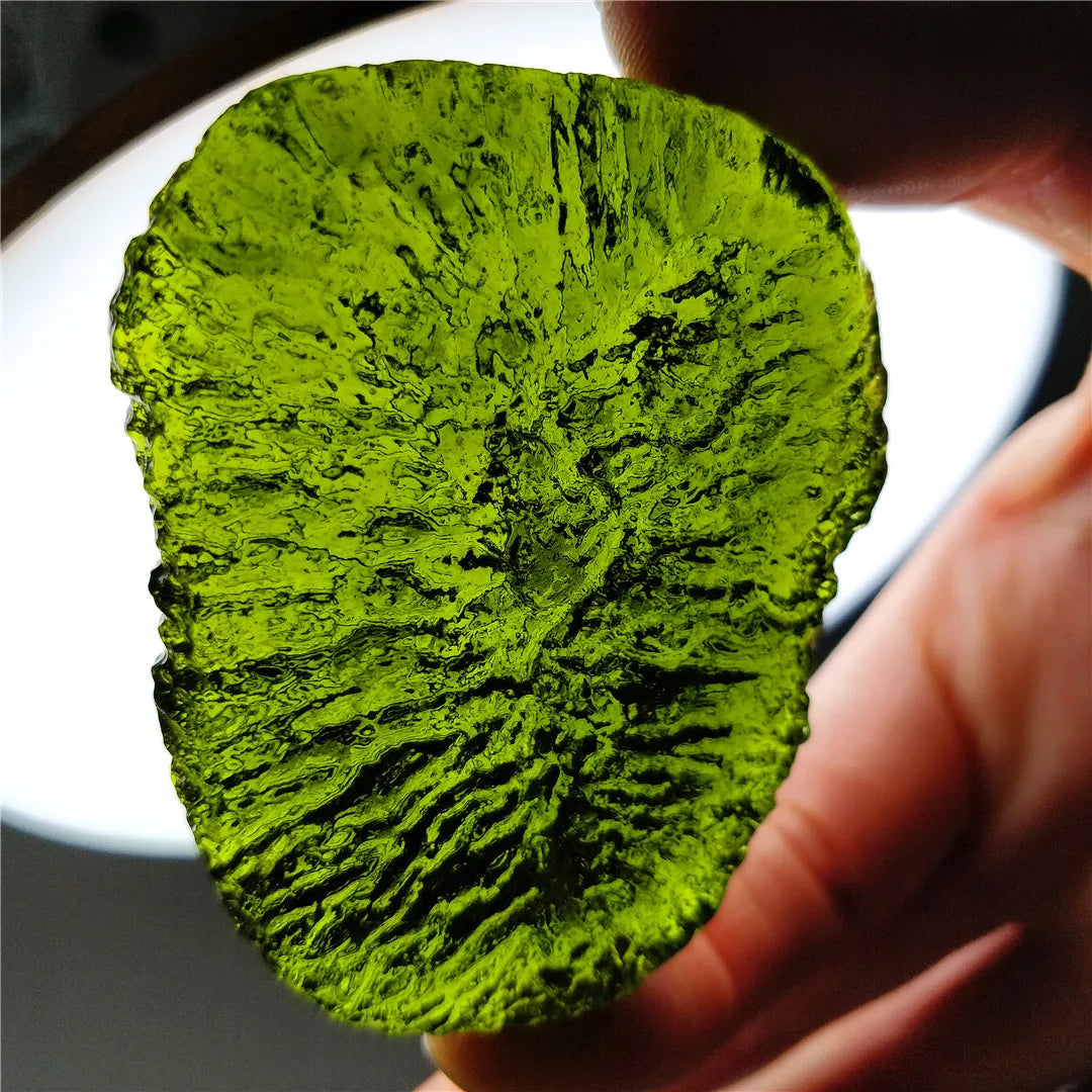 Discover the natural healing powers of the Rare Green Moldavite Crystal. Sourced from the Czech Republic, this crystal is known to relieve stress and anxiety while promoting emotional balance and spiritual growth. Add this unique crystal to your collection for its powerful benefits.