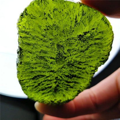 Discover the natural healing powers of the Rare Green Moldavite Crystal. Sourced from the Czech Republic, this crystal is known to relieve stress and anxiety while promoting emotional balance and spiritual growth. Add this unique crystal to your collection for its powerful benefits.