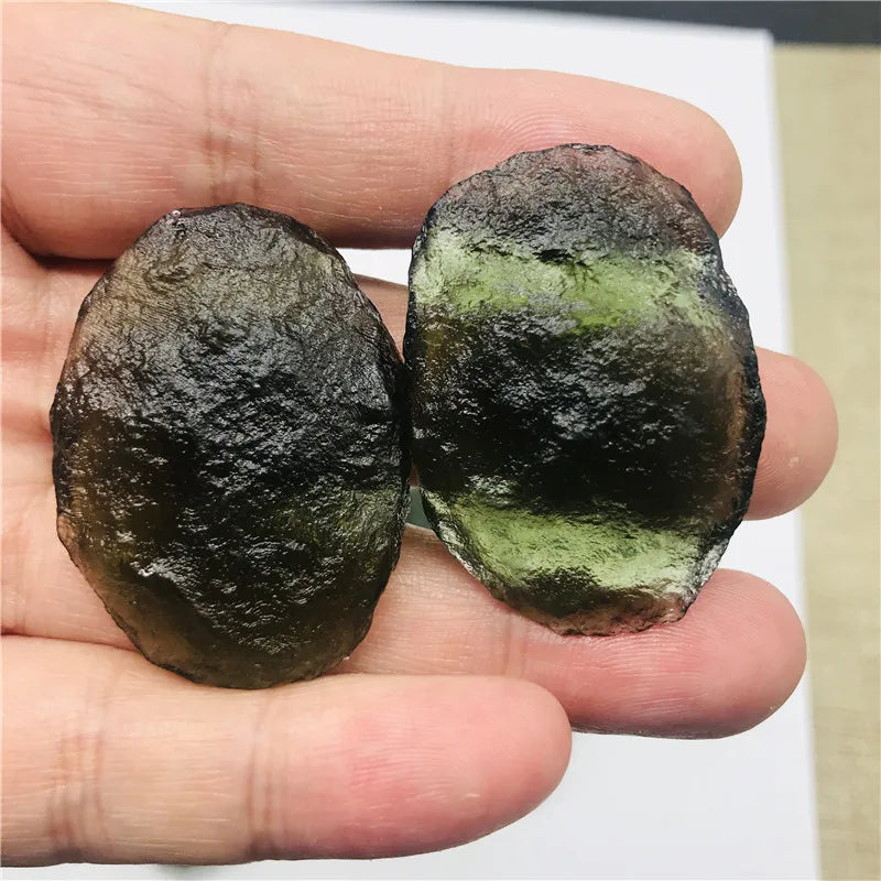 Discover the beauty and energy of our 1PC Raw Natural Rough Cut Green Moldavite. Crafted from the finest quality, this gem is believed to have healing and transformative powers. Add this unique piece to your collection and experience its natural, raw beauty. Perfect for any mineral enthusiast.