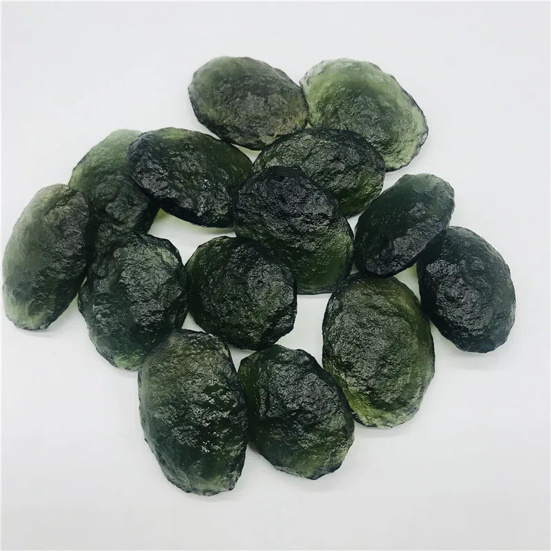 Discover the beauty and energy of our 1PC Raw Natural Rough Cut Green Moldavite. Crafted from the finest quality, this gem is believed to have healing and transformative powers. Add this unique piece to your collection and experience its natural, raw beauty. Perfect for any mineral enthusiast.