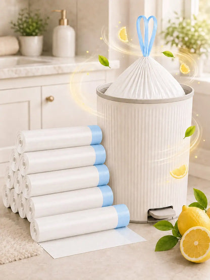 A white ribbed trash can with a blue handle and a white bag inserted, shown next to a stack of rolled white bags with blue ends in a bright kitchen setting. Lemons and green leaves are placed around the can, with glowing decorative swirls around the bag.