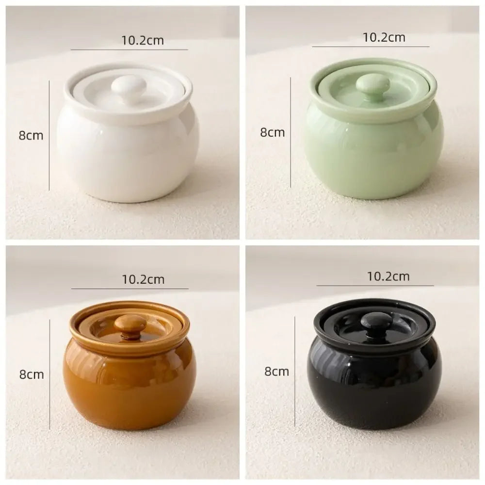 Four ceramic pots in different colors with dimensions displayed on a neutral background