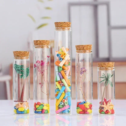 Introduce a touch of elegance and sophistication to your craft with our set of 5 clear straight glass bottles. Perfect for witch crafting and creating special potions, these bottles come with equally charming corks, making them both functional and visually appealing. Elevate your craft with these unique and exclusive bottles.